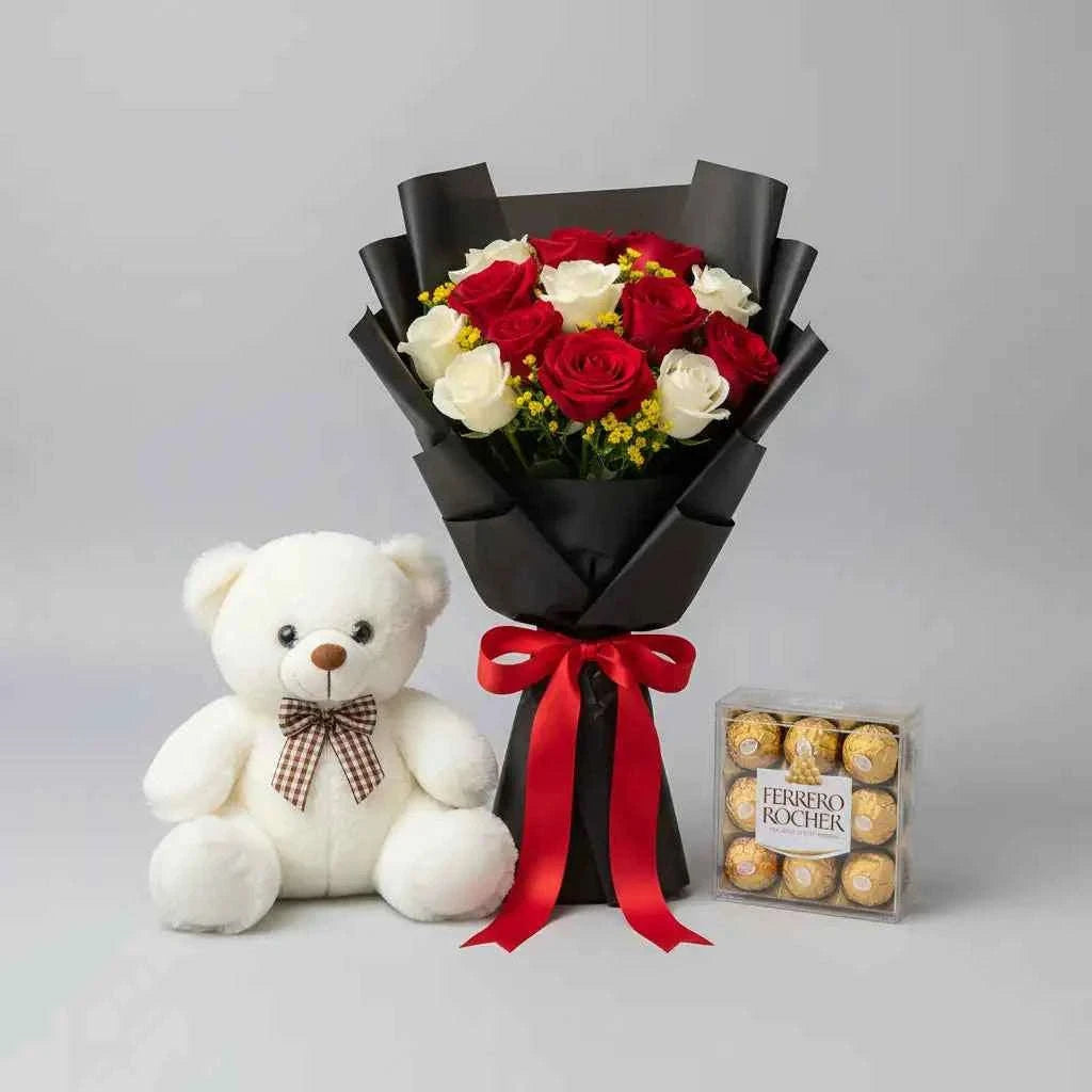 ورود حمراء وبيضاء مع دمية دب وشوكولاتة فيريرو روشيه flowerna